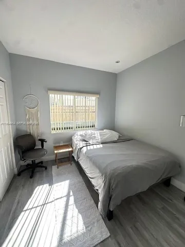 a view of a hallway with paintings on the wall