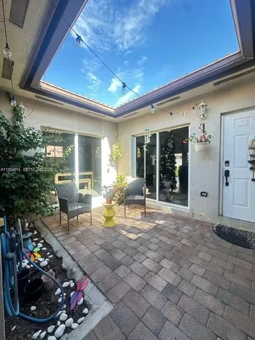a bedroom with a bed dresser and a window