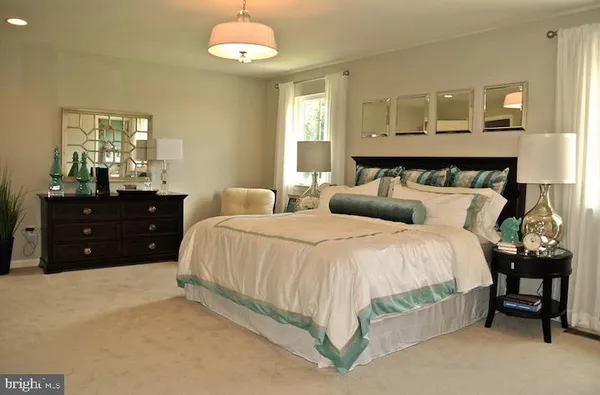 a bedroom with a bed and a table