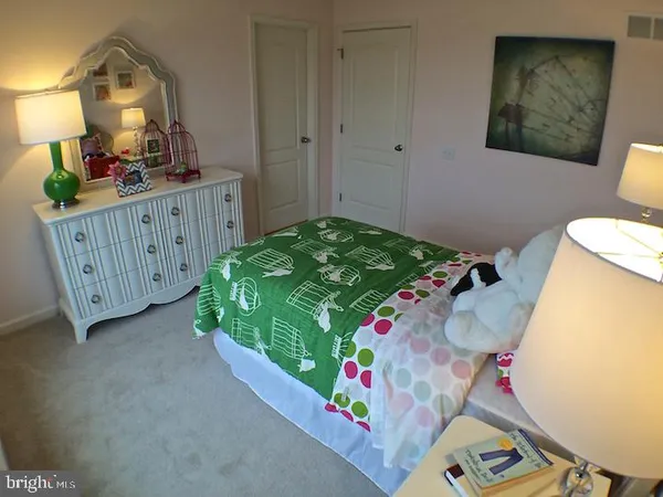a bedroom with bunk bed and a dresser
