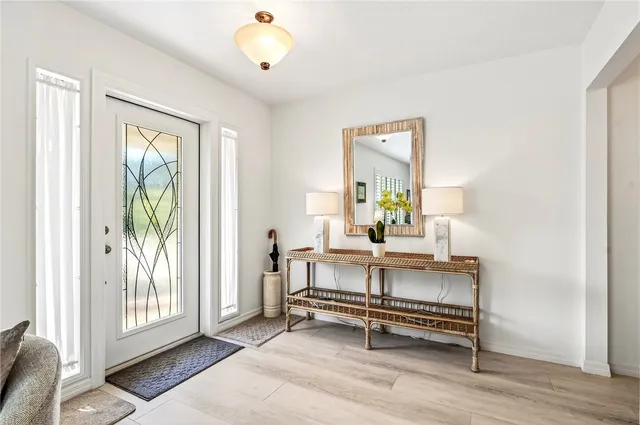 a view of room with window and wooden floor