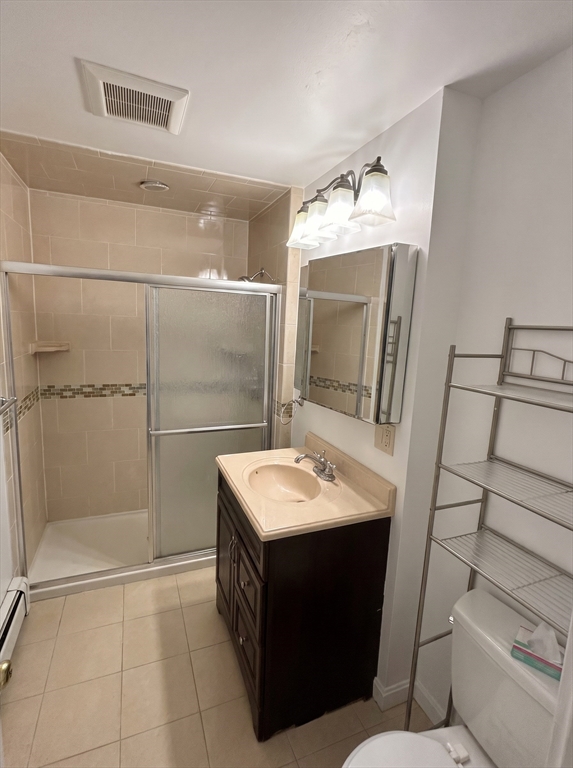 175 Coleman Street, Unit 2 Malden, MA 02148 - Photo 6 of 7 a bathroom with a sink toilet and shower