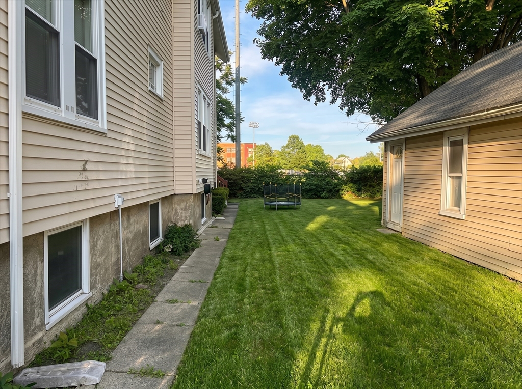 175 Coleman Street, Unit 2 Malden, MA 02148 - Photo 7 of 7 a backyard of a white house