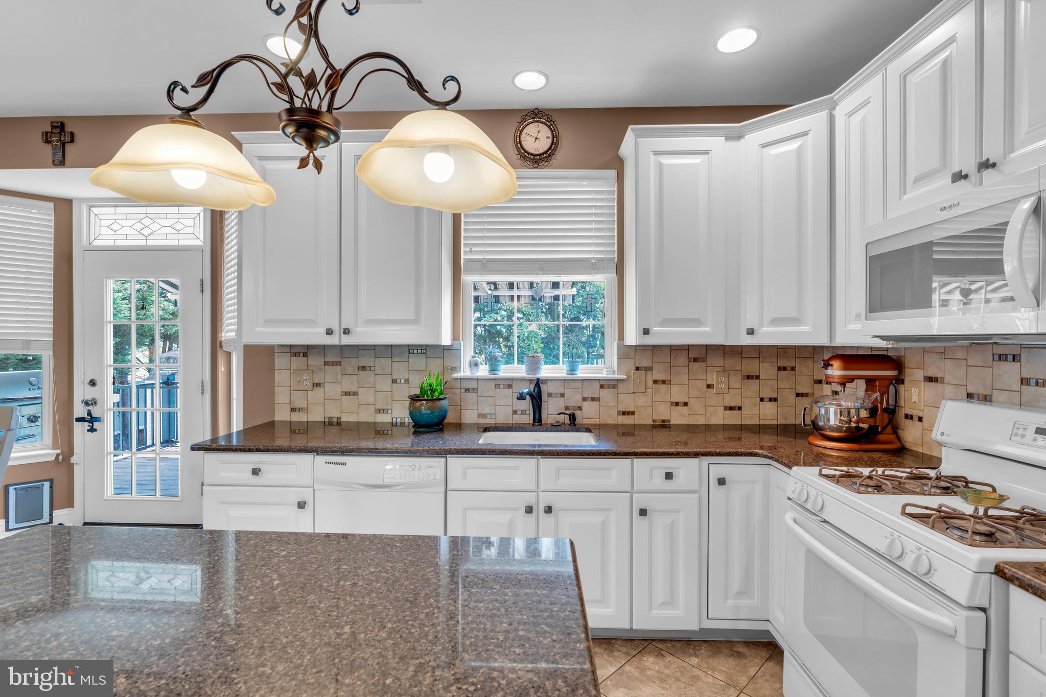 3 Pheasant Court, Unit 2710 Columbus, NJ 08022 - Photo 12 of 39 a kitchen with a white cabinets and window