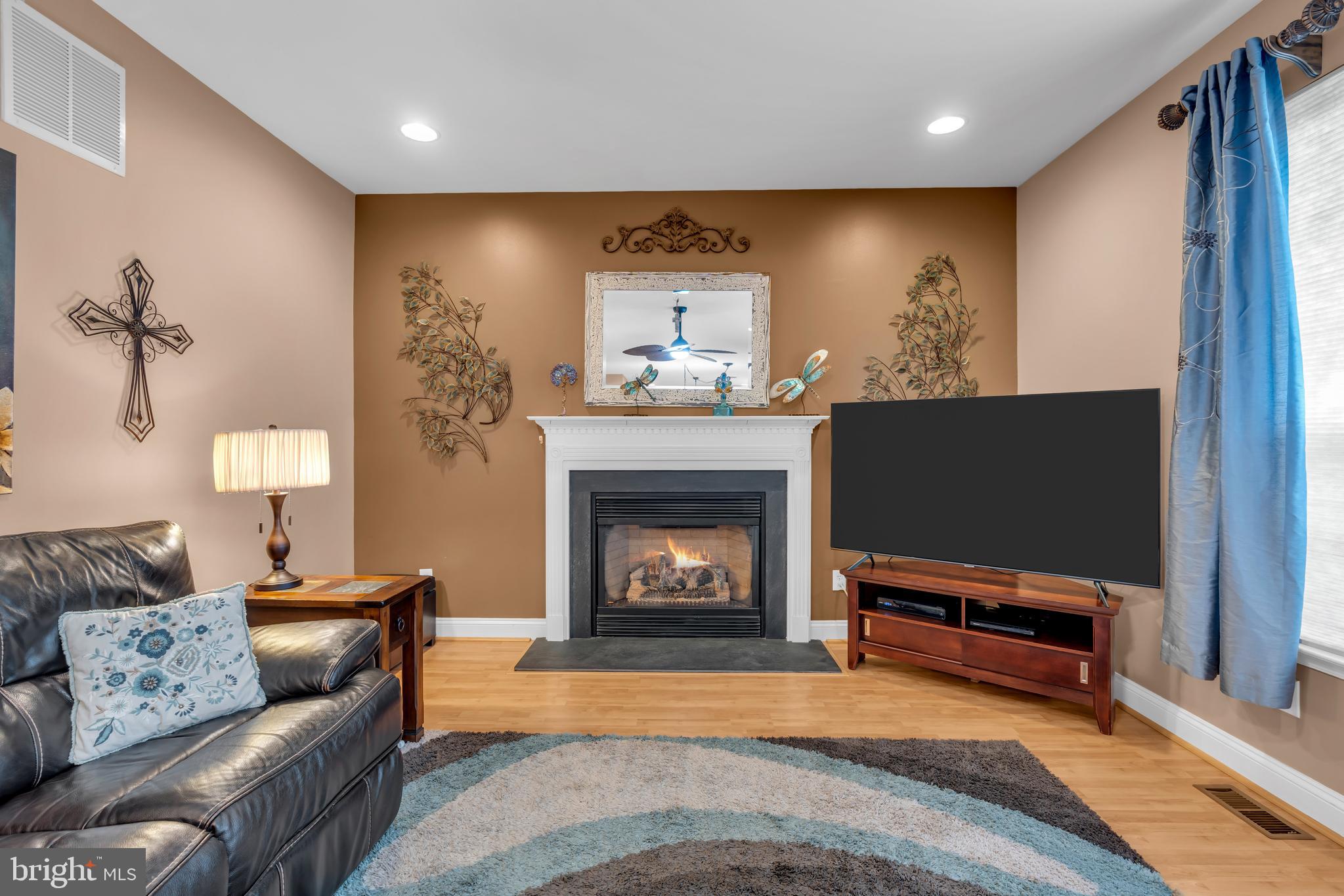 3 Pheasant Court, Unit 2710 Columbus, NJ 08022 - Photo 16 of 39 a living room with furniture and a fireplace