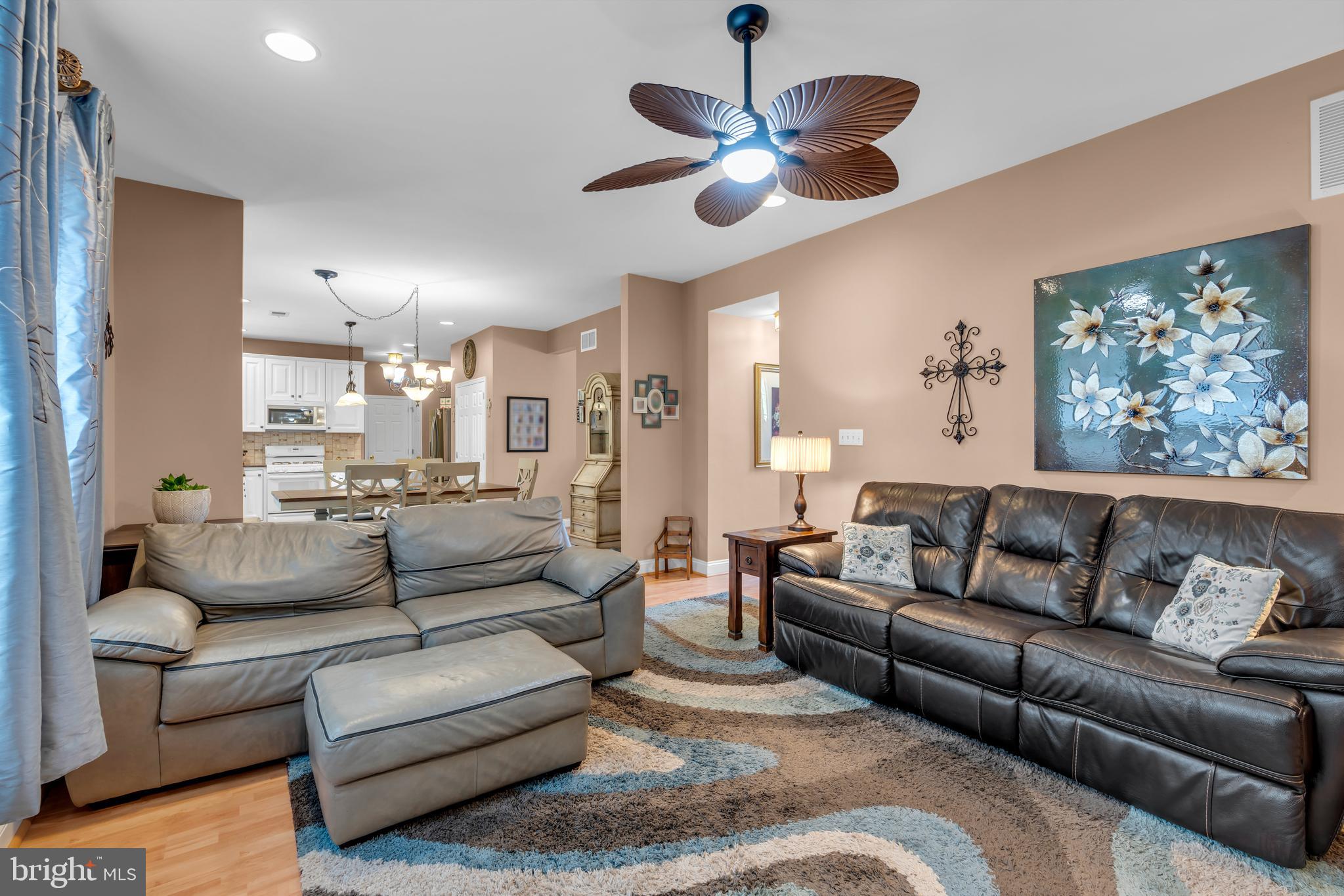 3 Pheasant Court, Unit 2710 Columbus, NJ 08022 - Photo 18 of 39 a living room with furniture ceiling fan and a large window