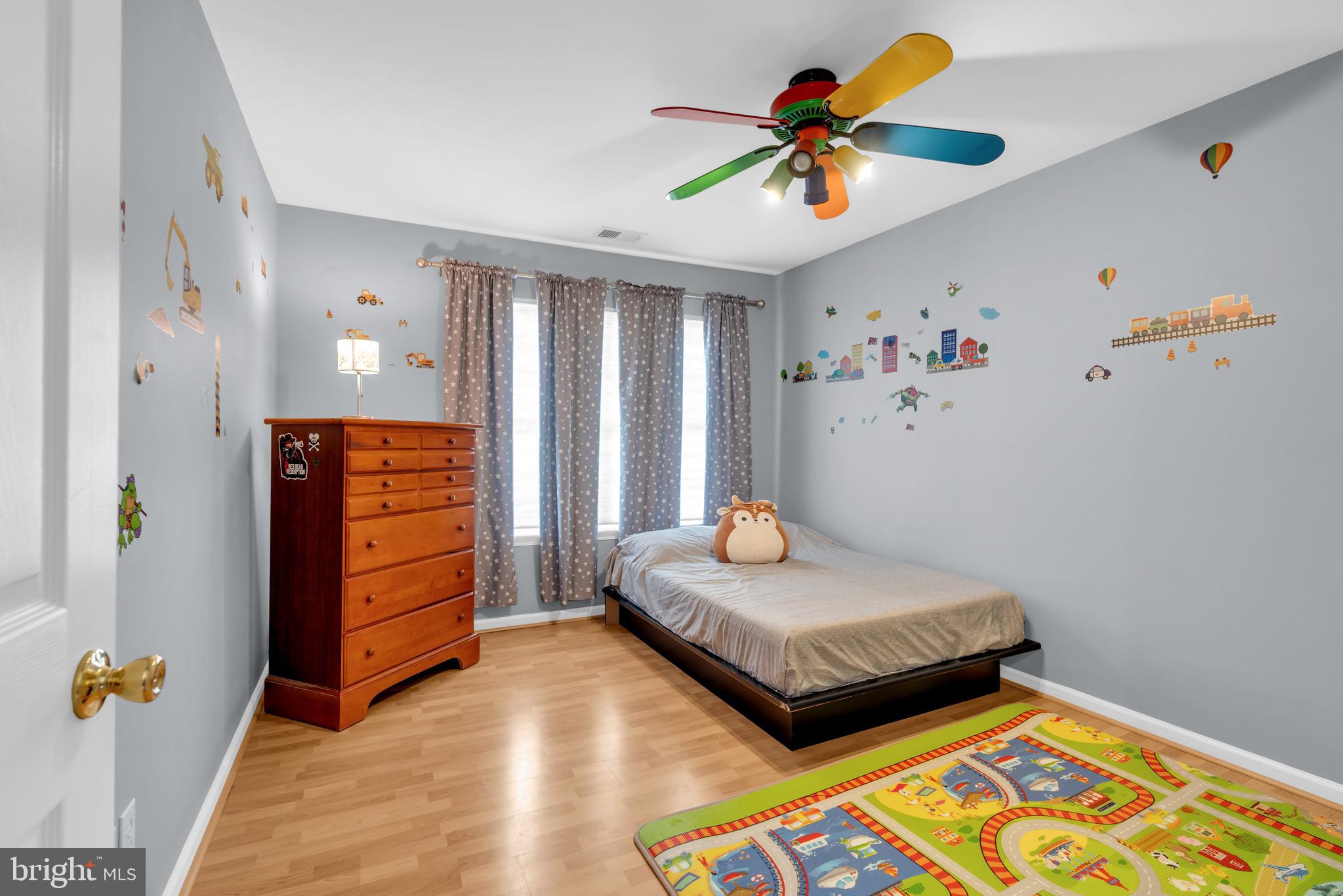 3 Pheasant Court, Unit 2710 Columbus, NJ 08022 - Photo 27 of 39 a bedroom with a bed and a chandelier