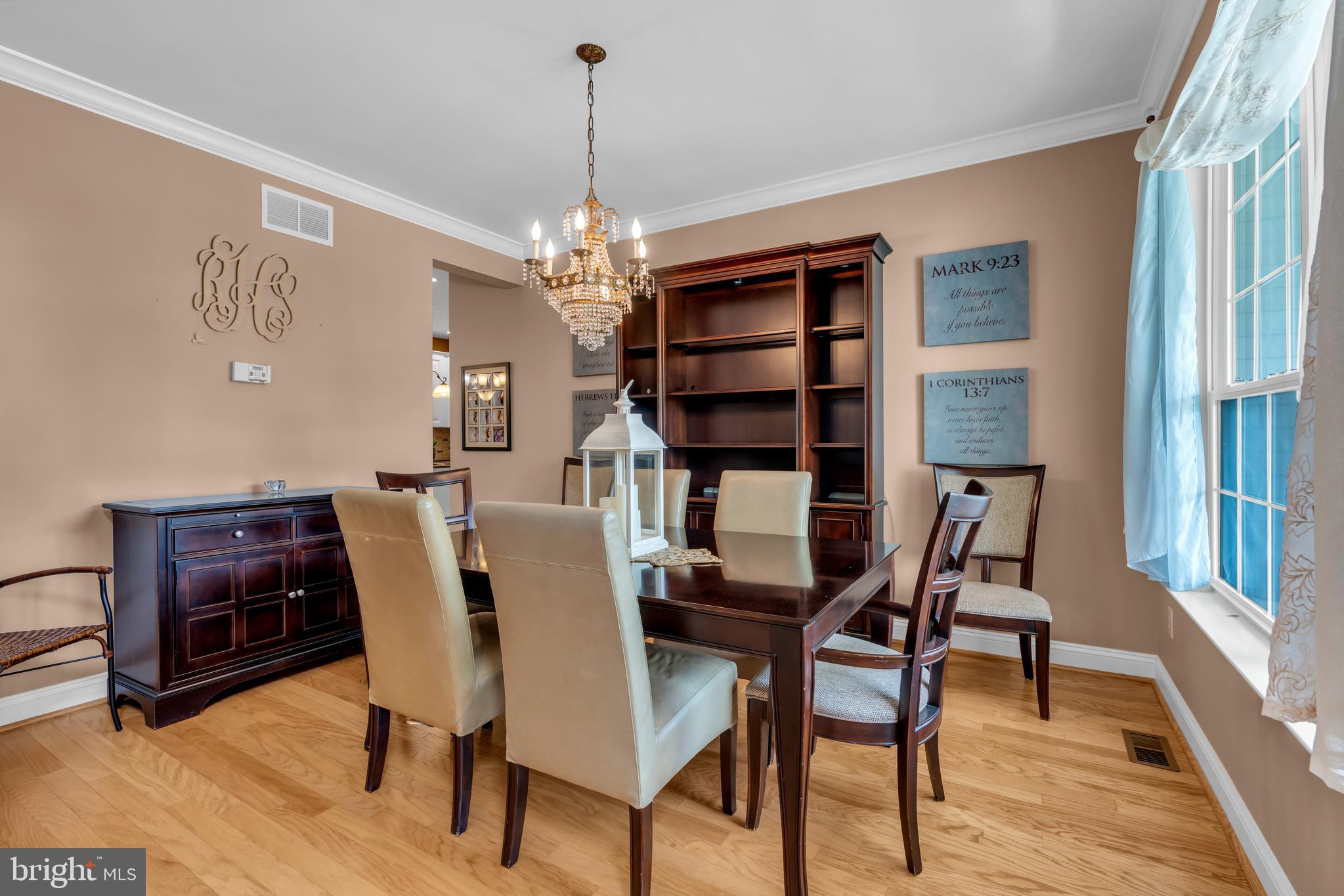 3 Pheasant Court, Unit 2710 Columbus, NJ 08022 - Photo 3 of 39 a view of a dining room with furniture window and wooden floor