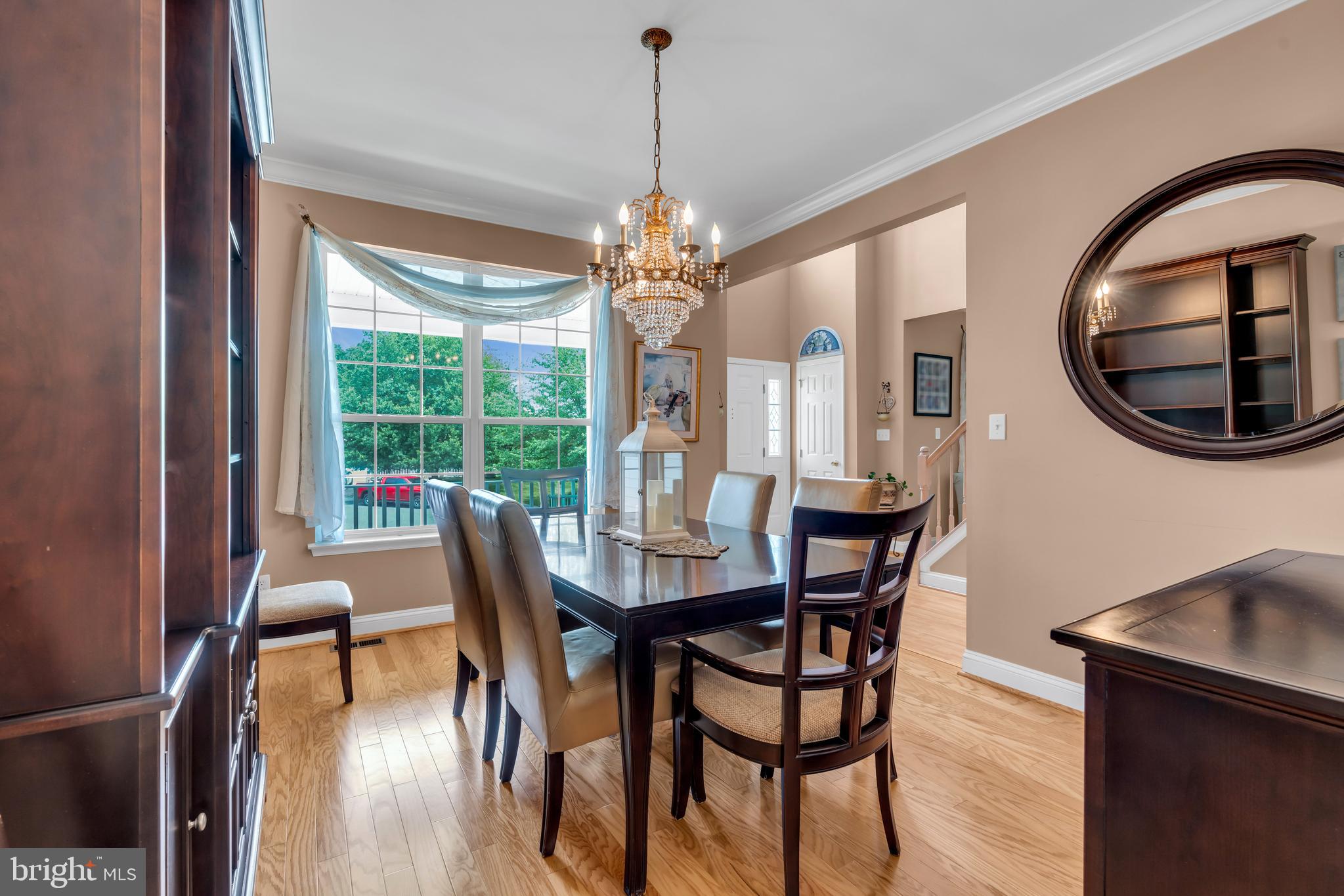 3 Pheasant Court, Unit 2710 Columbus, NJ 08022 - Photo 4 of 39 a view of a dining room with furniture window and wooden floor