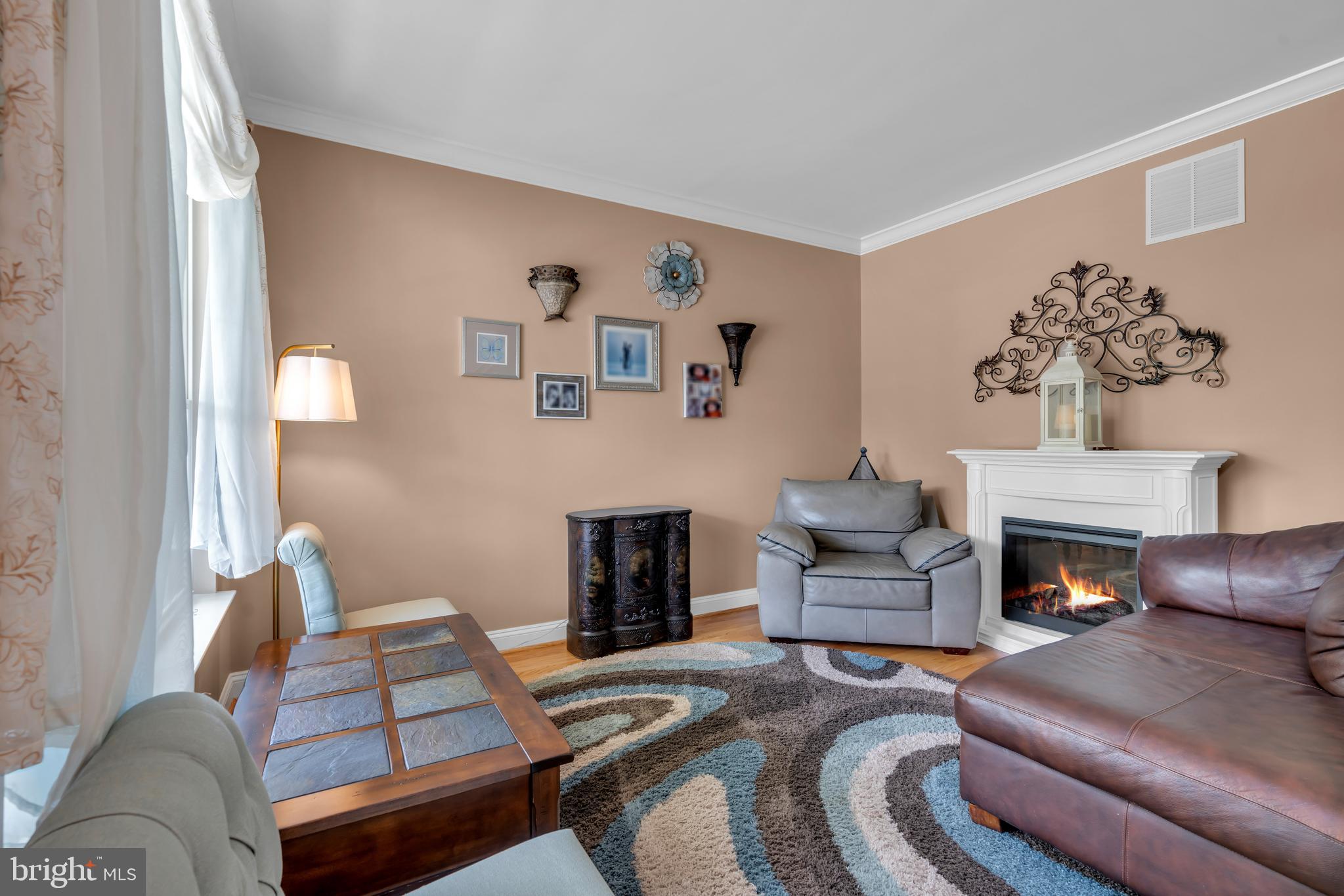 3 Pheasant Court, Unit 2710 Columbus, NJ 08022 - Photo 5 of 39 a living room with furniture and a fireplace