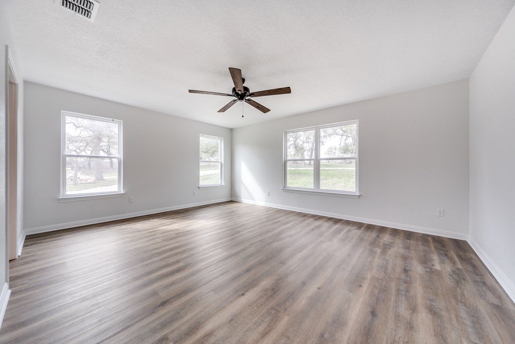 955 Axis Circle Fredericksburg, TX 78624 - Photo 10 of 41 Awake with amazing views from the primary bedroom.