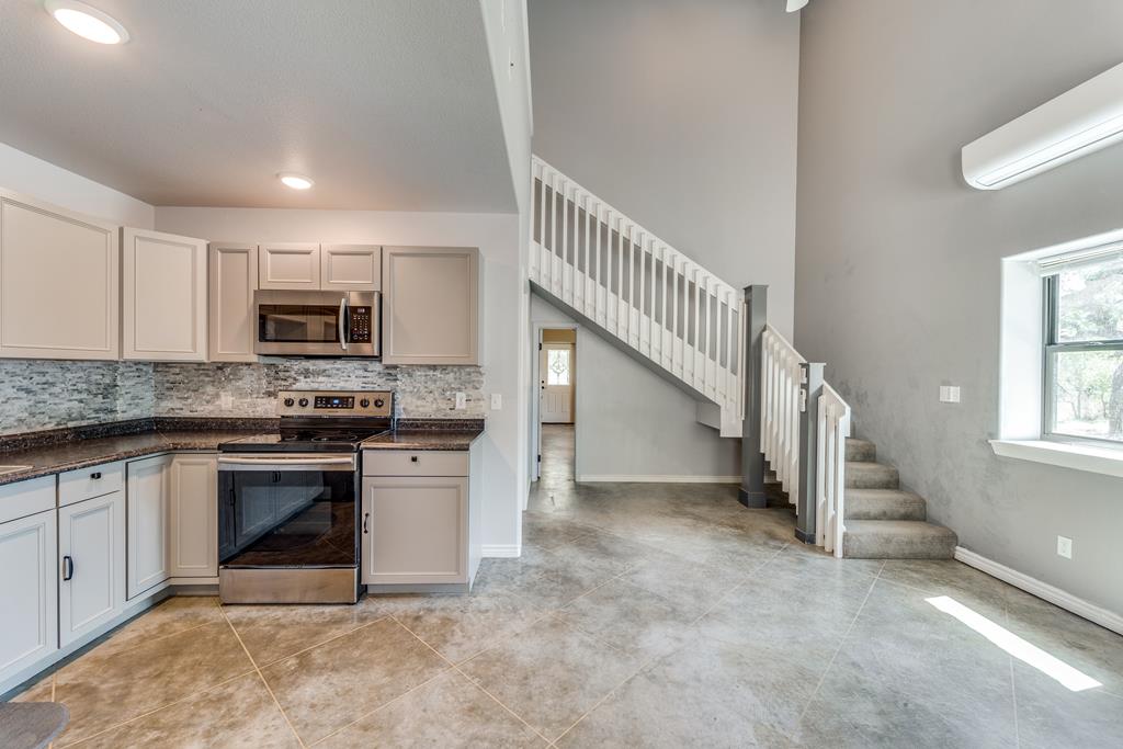 955 Axis Circle Fredericksburg, TX 78624 - Photo 24 of 41 Front apartment has doorway under stairs to back a