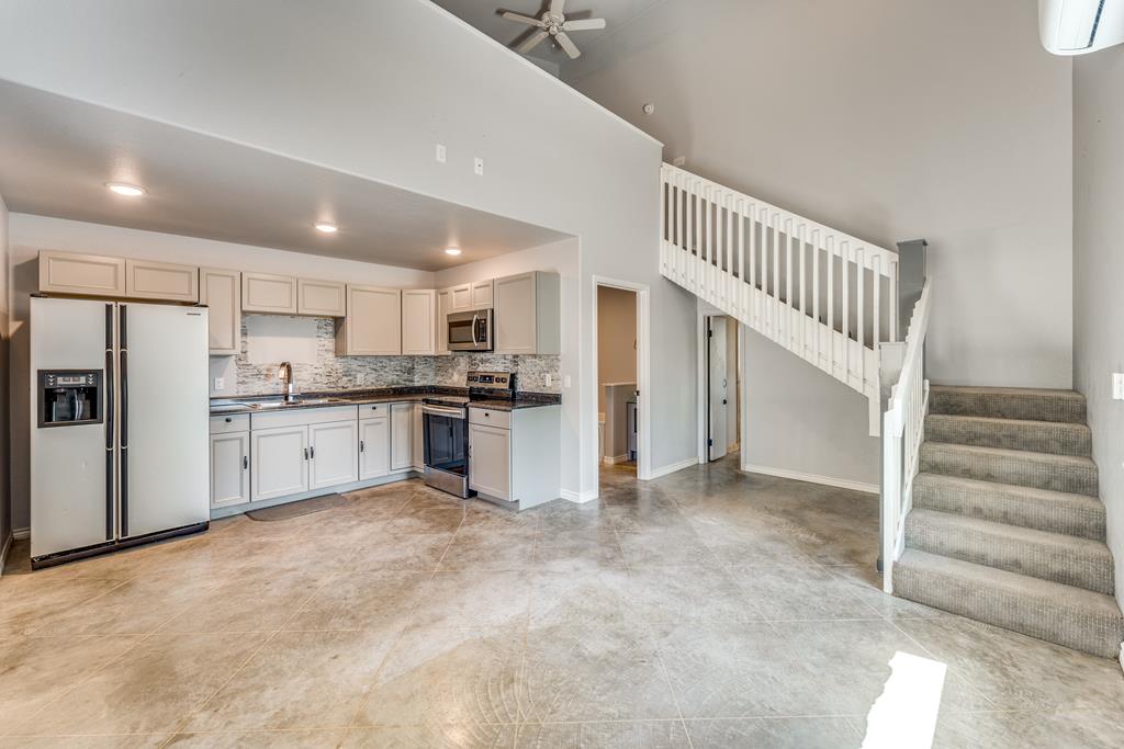 955 Axis Circle Fredericksburg, TX 78624 - Photo 25 of 41 Front apartment kitchen w/ stairs leading up to th