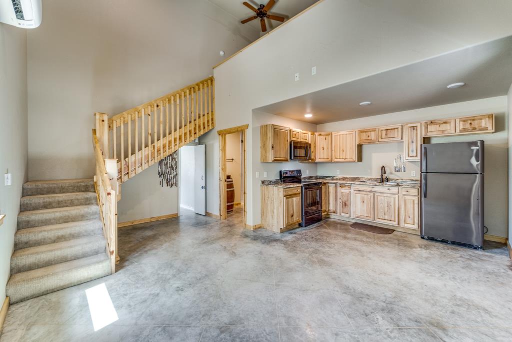 955 Axis Circle Fredericksburg, TX 78624 - Photo 31 of 41 Doorway under the stairs can be locked, but leads