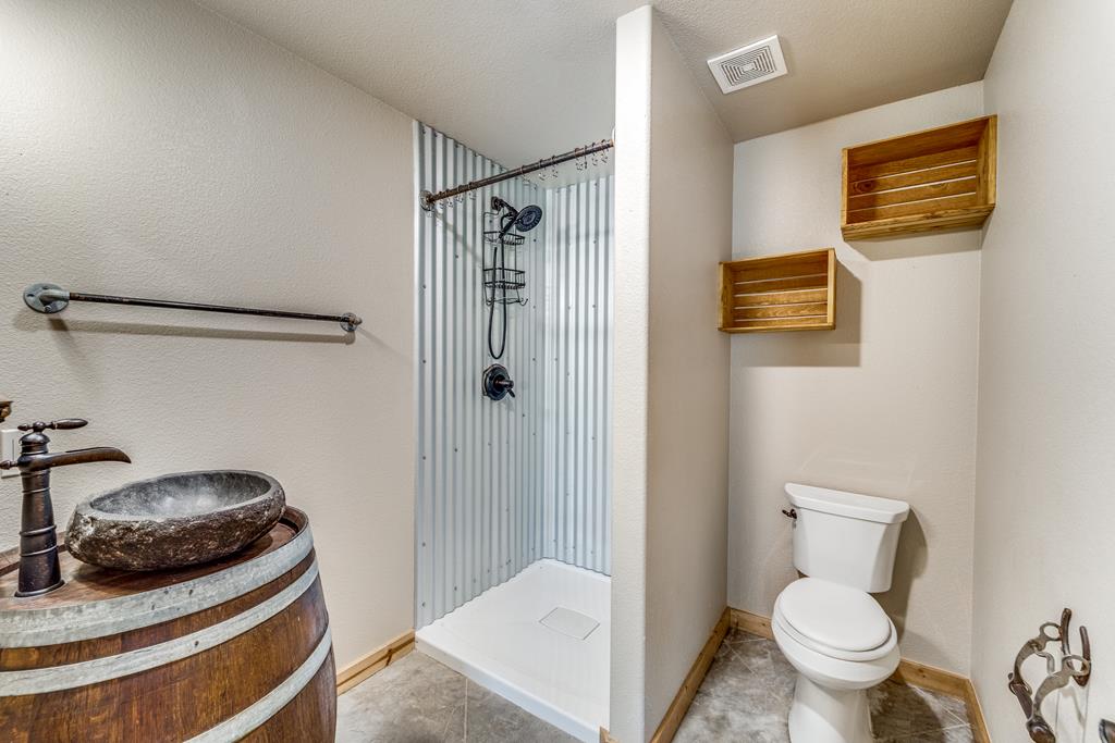 955 Axis Circle Fredericksburg, TX 78624 - Photo 32 of 41 Back apartment bathroom has a stand up shower.