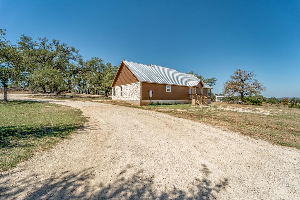 955 Axis Circle Fredericksburg, TX 78624 - Photo 34 of 41 View of the main house from the barndo.