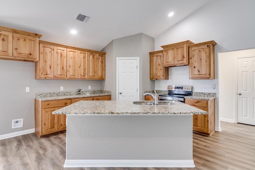 955 Axis Circle Fredericksburg, TX 78624 - Photo 8 of 41 Kitchen island with good sized corner pantry.