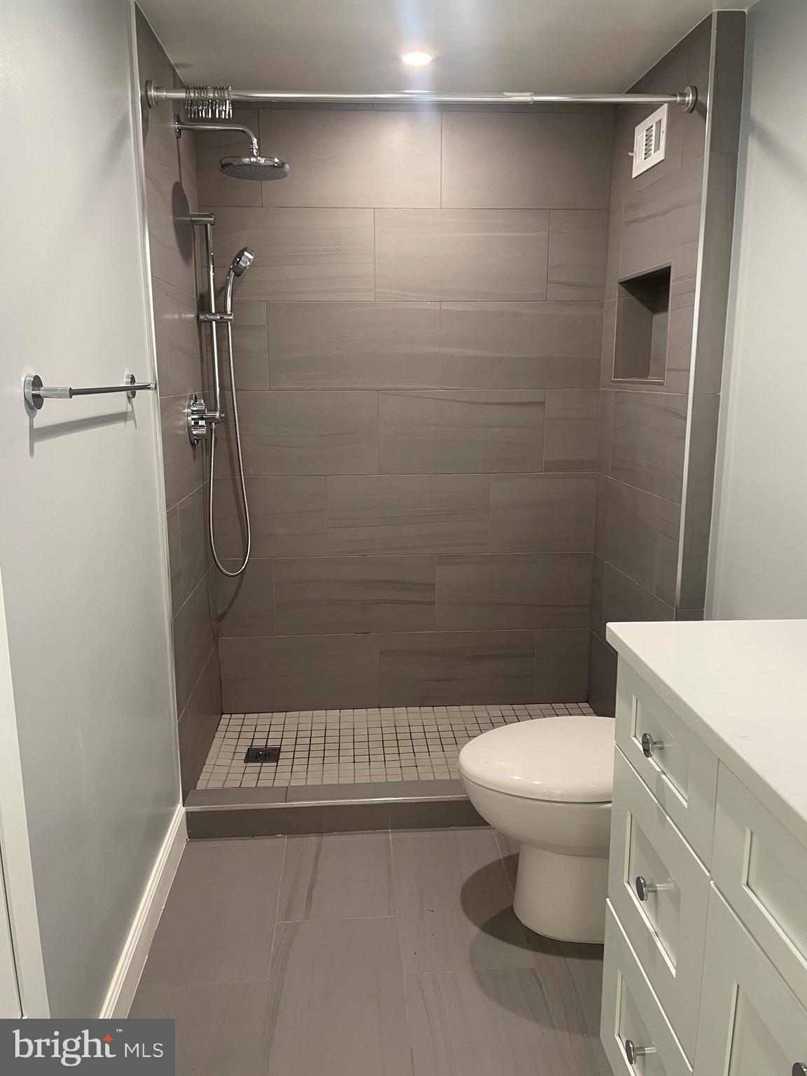 5225 Pooks Hill Road, Unit 828S Bethesda, MD 20814 - Photo 20 of 63 a bathroom with a toilet and a shower