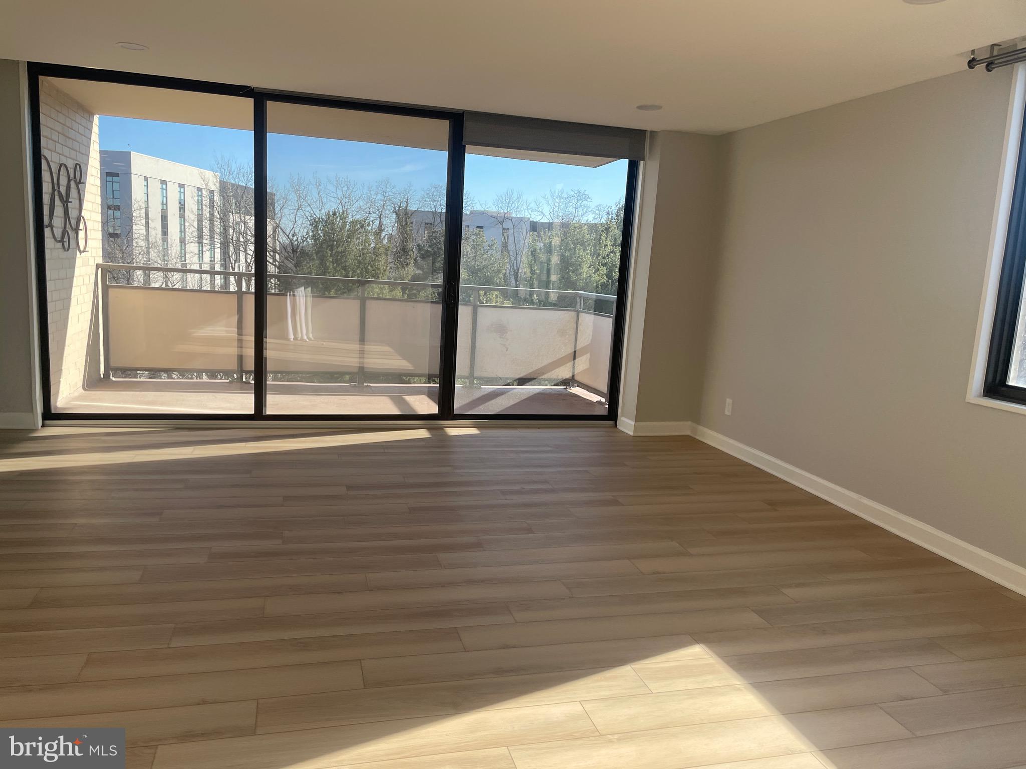 5225 Pooks Hill Road, Unit 828S Bethesda, MD 20814 - Photo 20 of 72 a view of empty room with wooden floor and fan