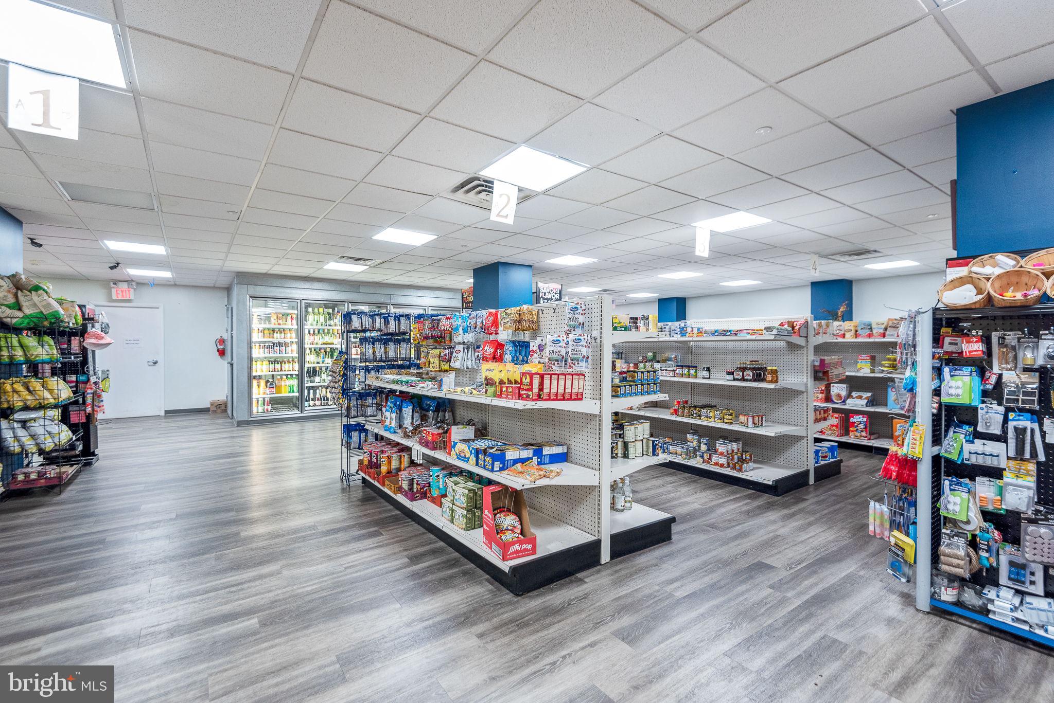 5225 Pooks Hill Road, Unit 828S Bethesda, MD 20814 - Photo 37 of 63 a room with lots of furniture and wooden floors
