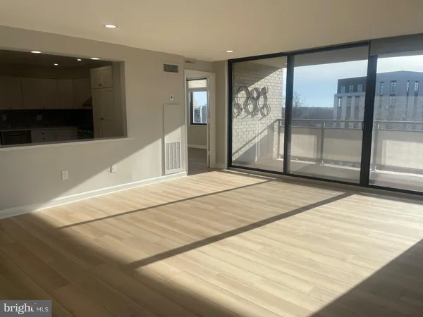 a bedroom with a large bed and a large window