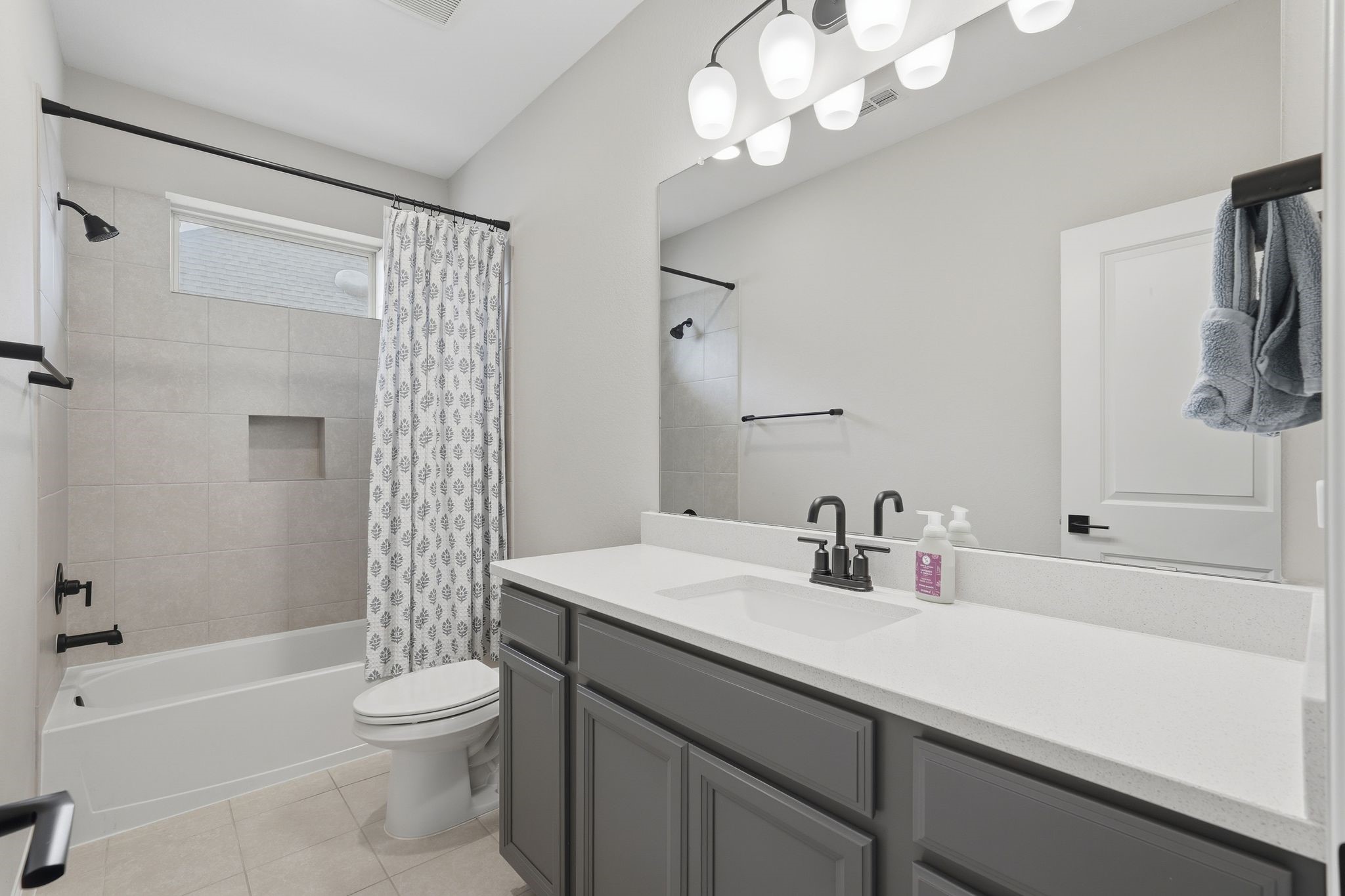 24423 Morningside Terrace Tomball, TX 77375 - Photo 21 of 47 a bathroom with a sink a toilet a shower curtain and a mirror