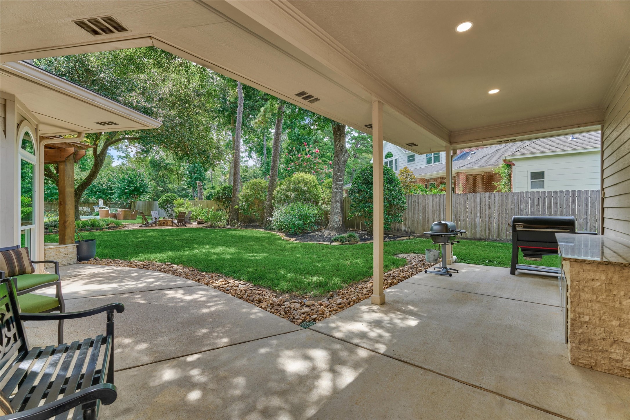 18 Treevine Court The Woodlands, TX 77381 - Photo 45 of 50 Host unforgettable backyard BBQs at the outdoor grill station, perfect for entertaining family and friends.