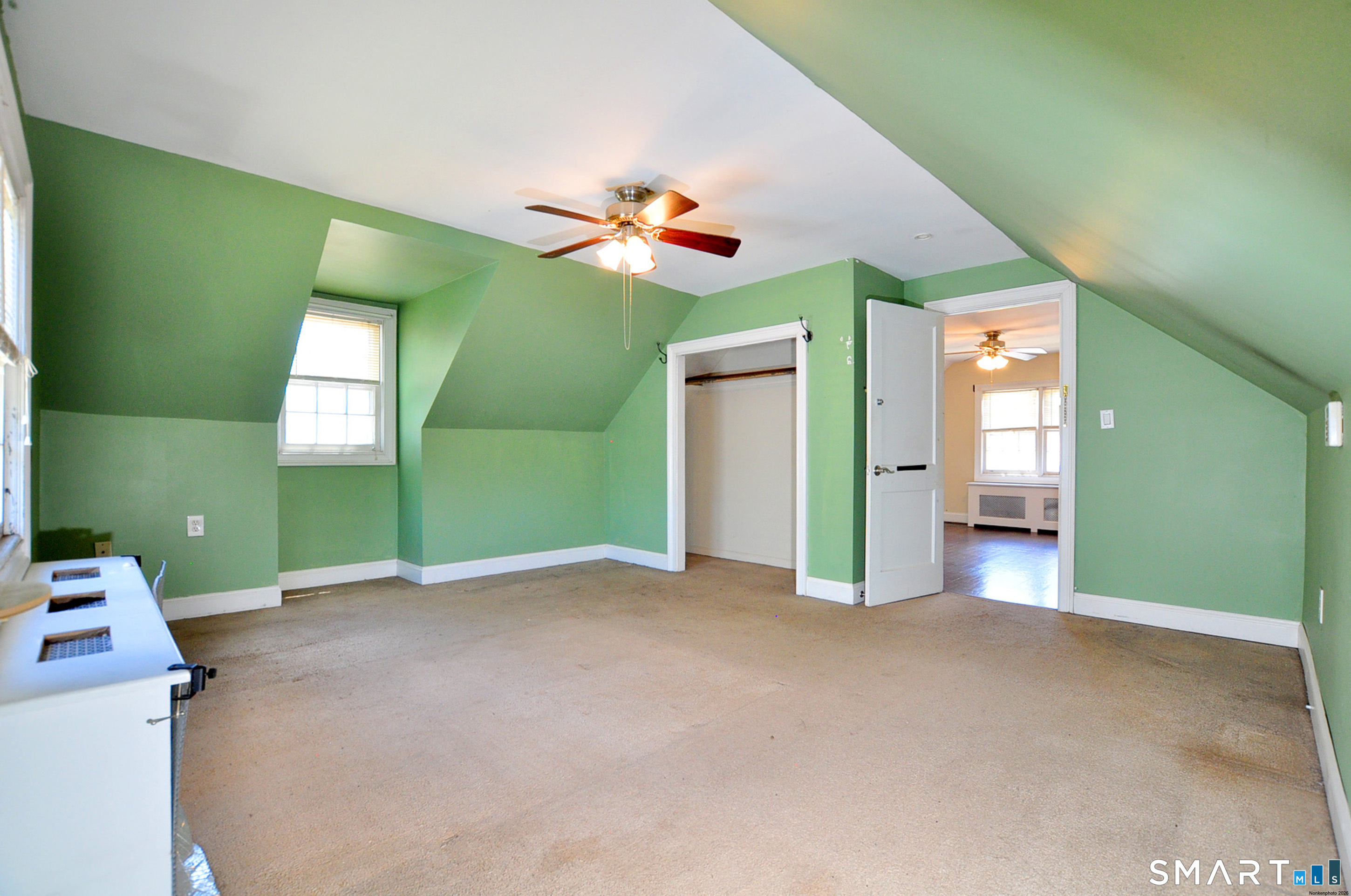 103 West Center Street Manchester, CT 06040 - Photo 27 of 29 an empty room with windows and fan