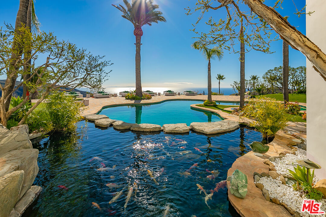 10502 Yellow Hill Road Malibu, CA 90265 - Photo 11 of 22 a view of a swimming pool with a patio