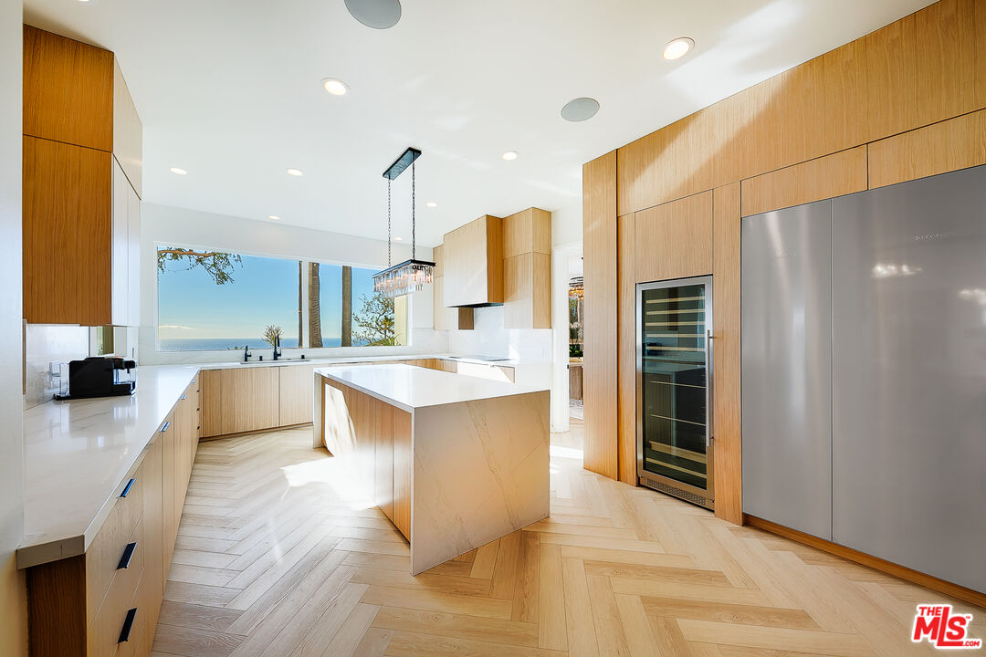 10502 Yellow Hill Road Malibu, CA 90265 - Photo 13 of 22 a large white kitchen with a large window