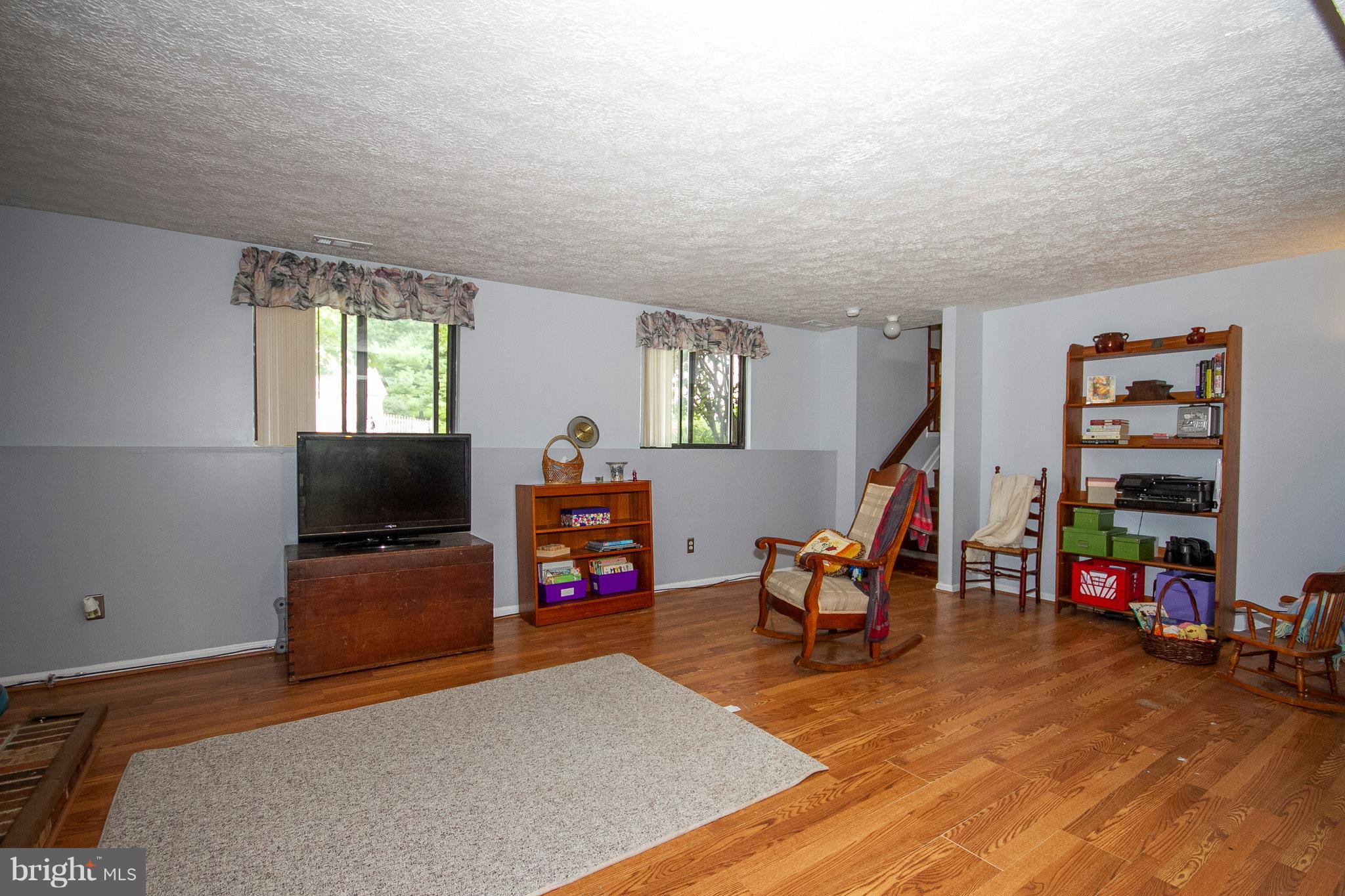 9513 Hallhurst Road Baltimore, MD 21236 - Photo 23 of 30 a living room with furniture and a flat screen tv