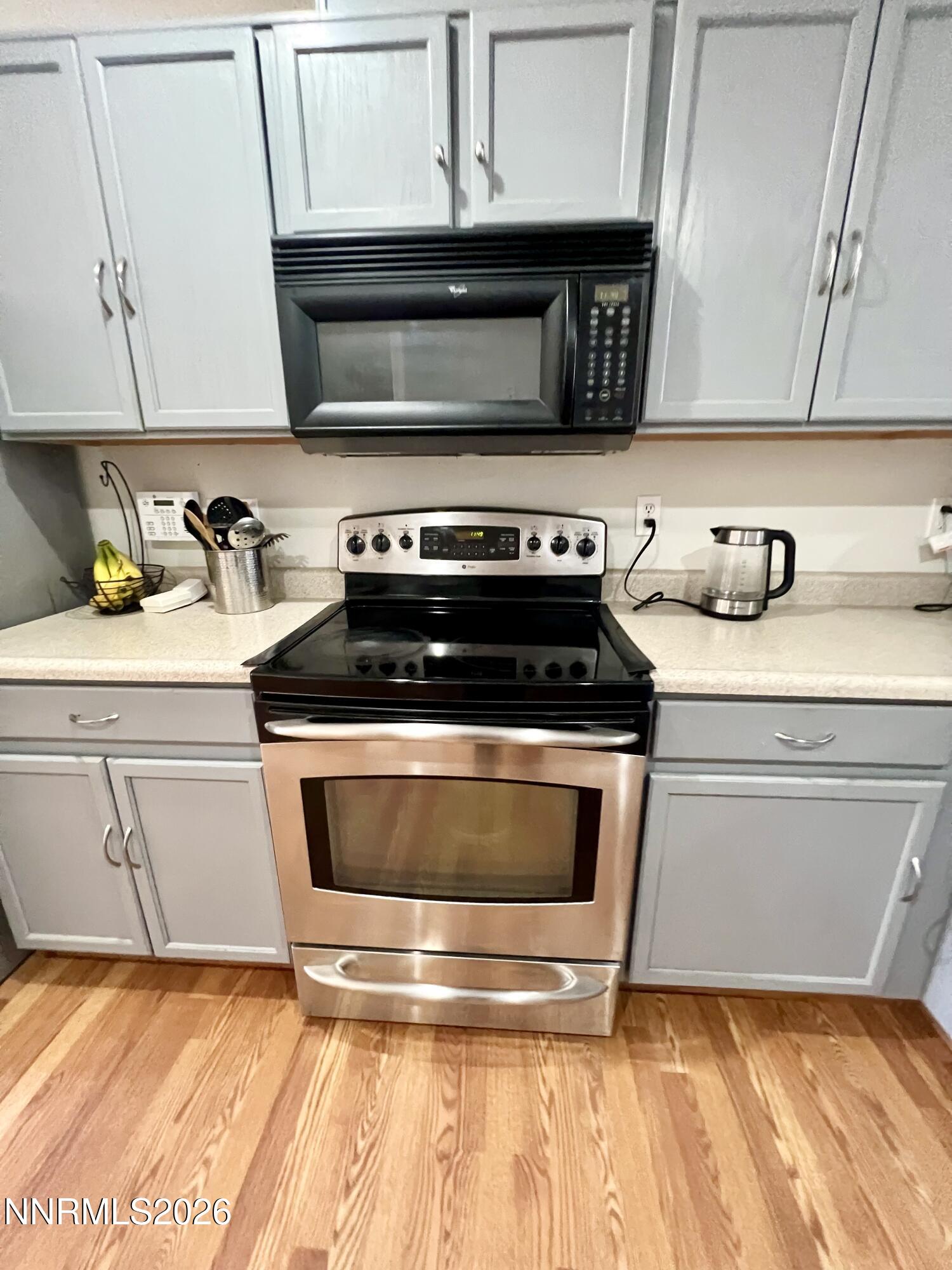 7690 East Key Largo Court Reno, NV 89506 - Photo 14 of 24 a kitchen with a stove and a sink