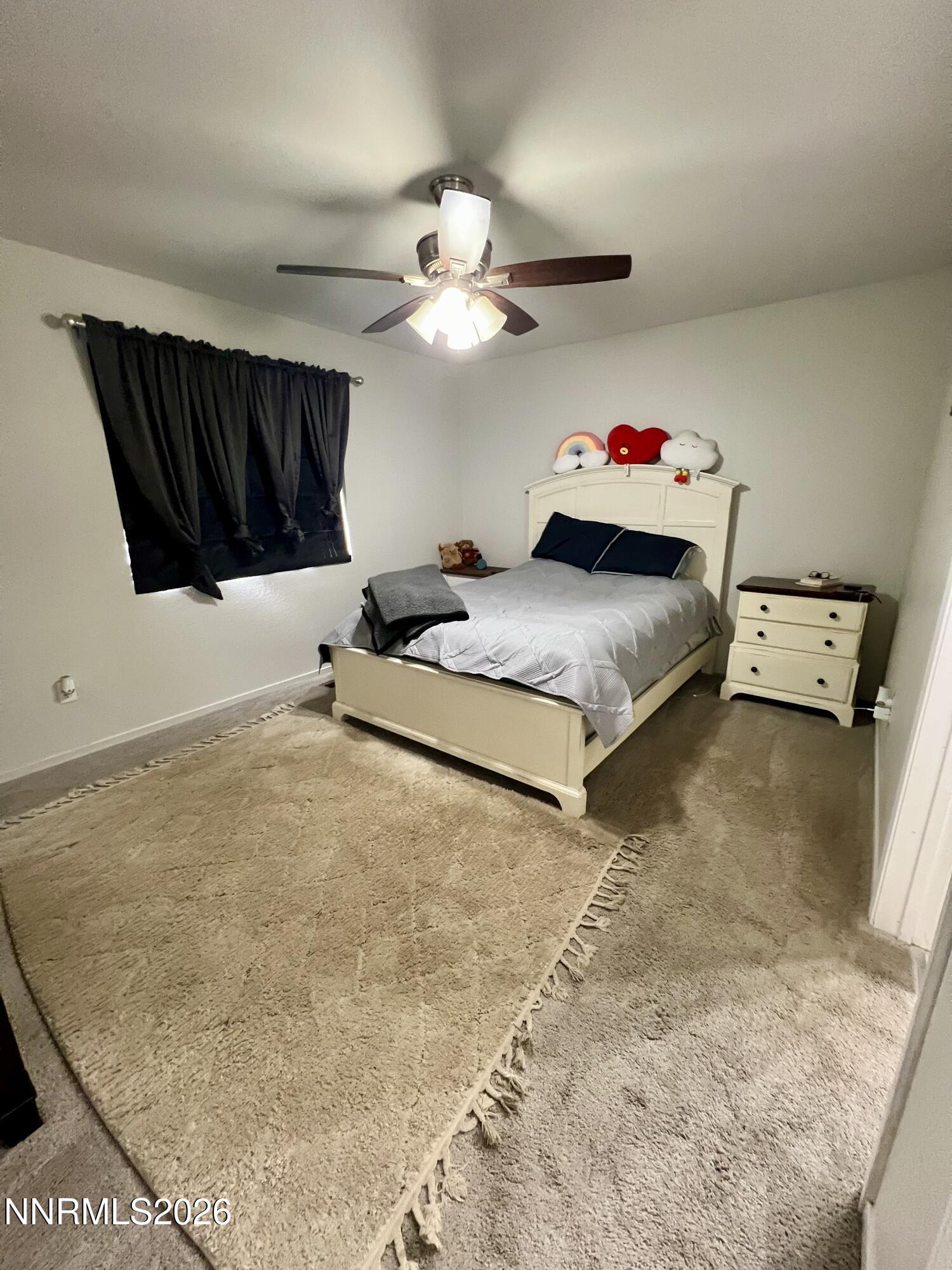 7690 East Key Largo Court Reno, NV 89506 - Photo 15 of 24 a bedroom with a bed and a large mirror on the wall