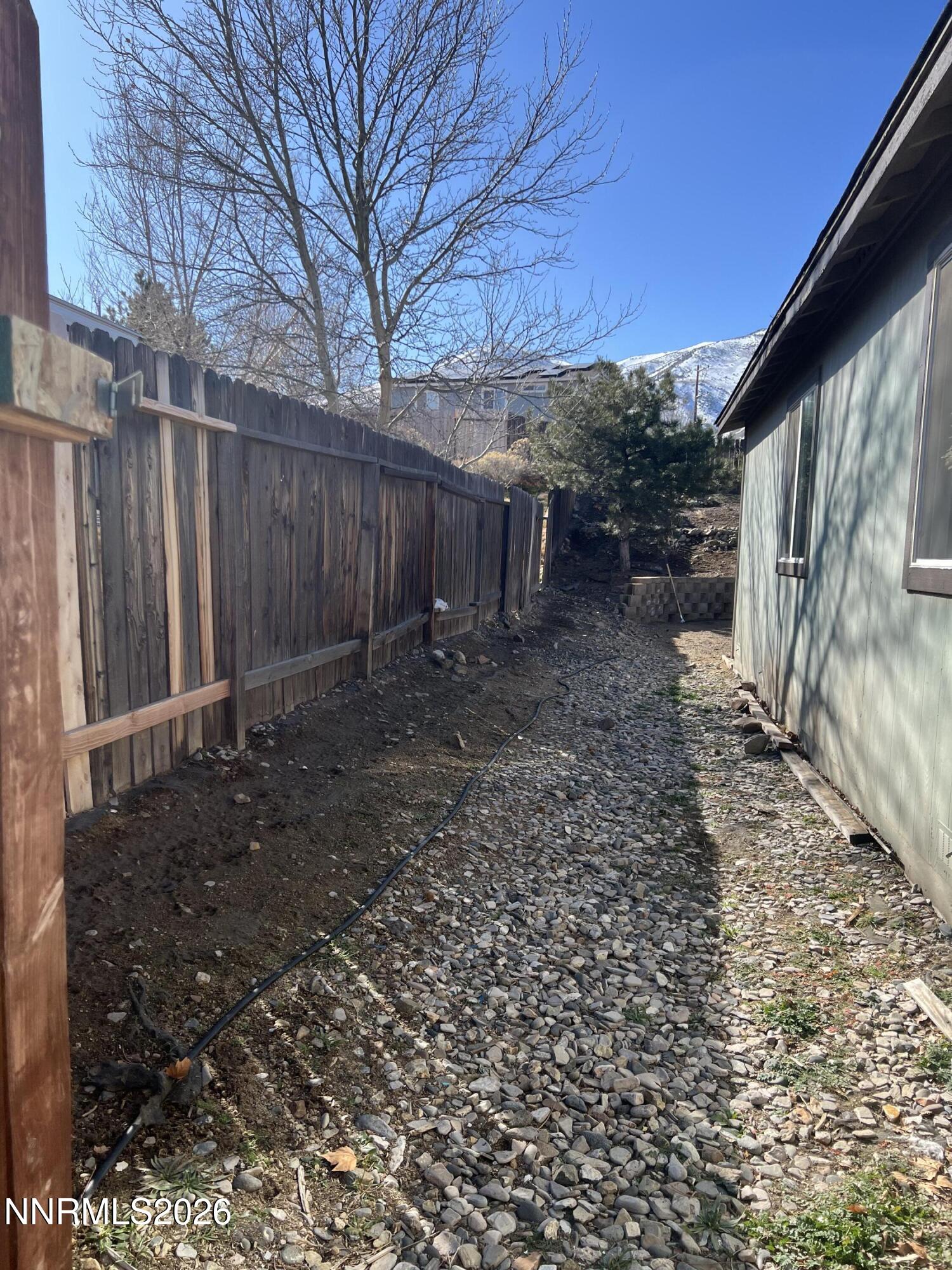 7690 East Key Largo Court Reno, NV 89506 - Photo 4 of 24 a backyard of a house with lots of green space