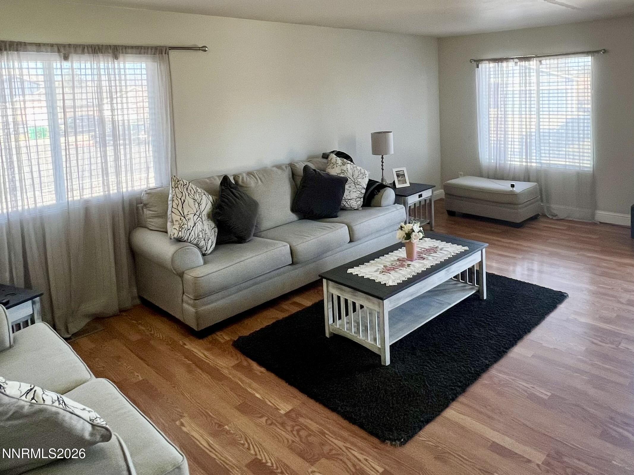 7690 East Key Largo Court Reno, NV 89506 - Photo 7 of 24 a living room with furniture and a window