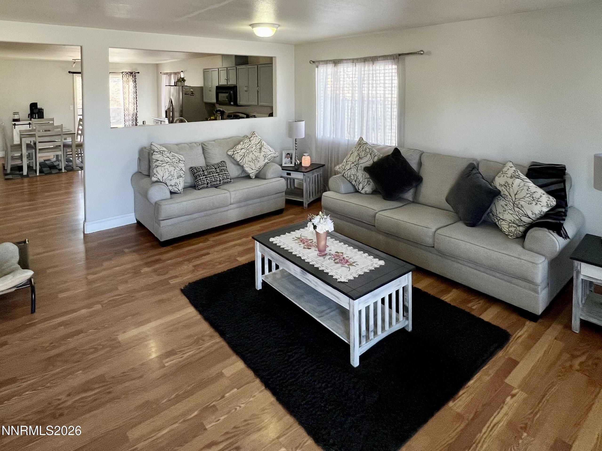 7690 East Key Largo Court Reno, NV 89506 - Photo 8 of 24 a living room with furniture and a couch
