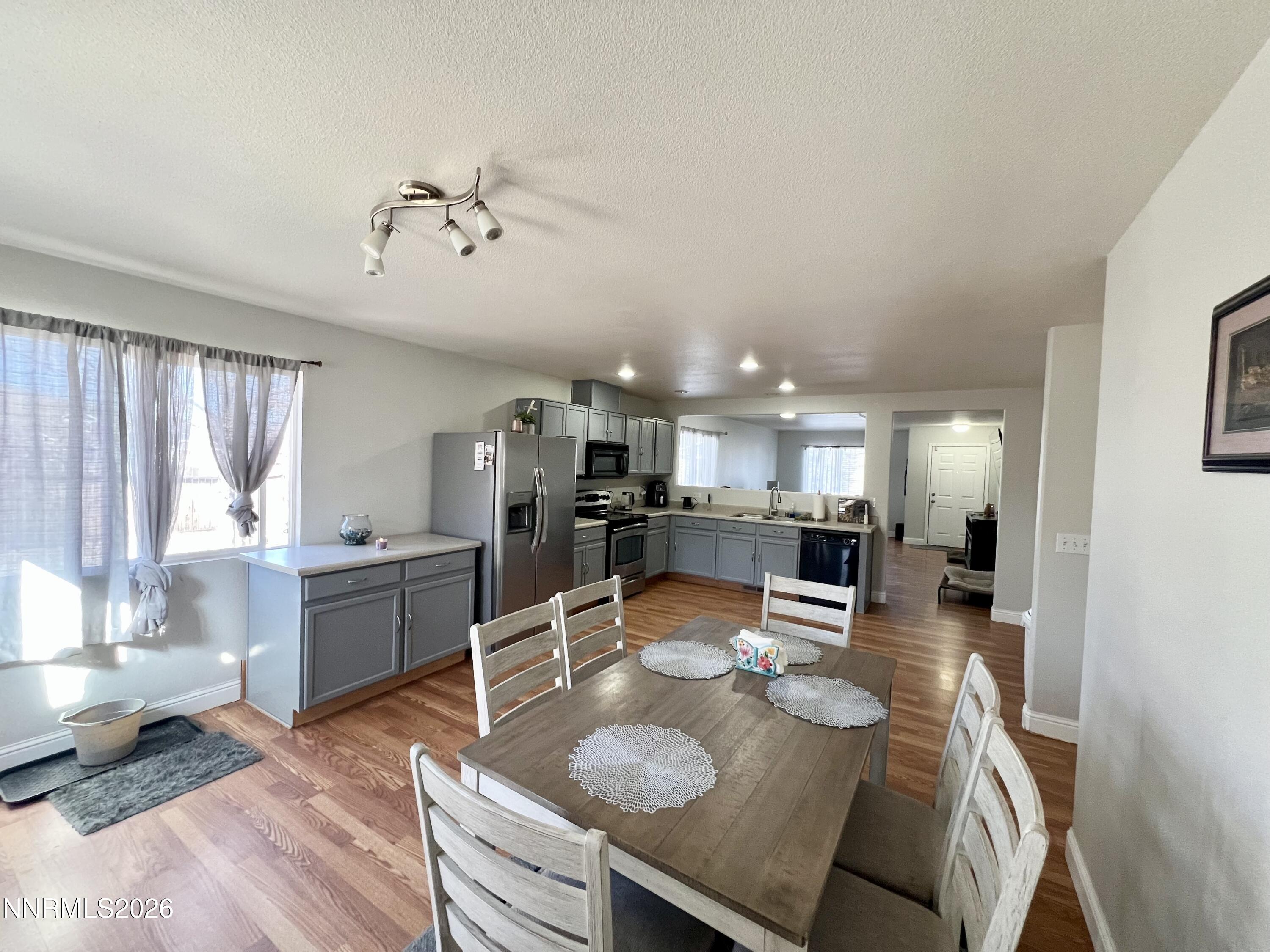7690 East Key Largo Court Reno, NV 89506 - Photo 10 of 24 a large kitchen with a table and chairs