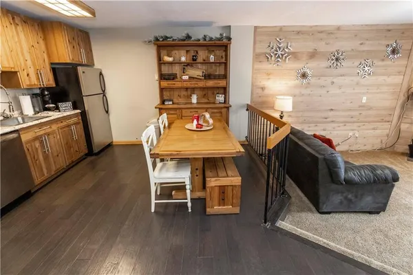 a dining room with furniture and wooden floor