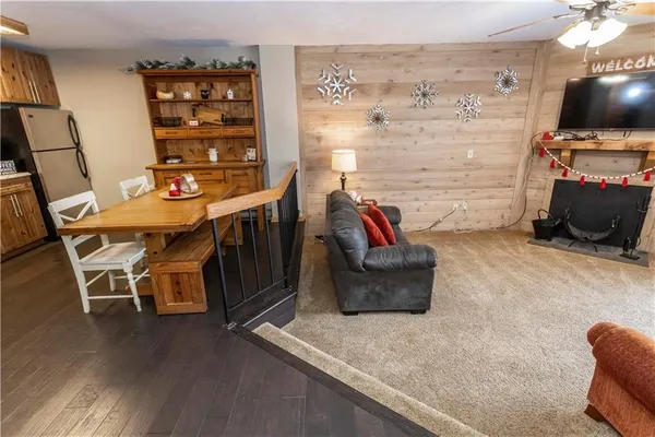 a view of a livingroom with furniture and a flat screen tv