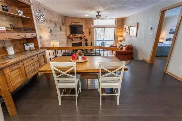 a dining room with furniture and window