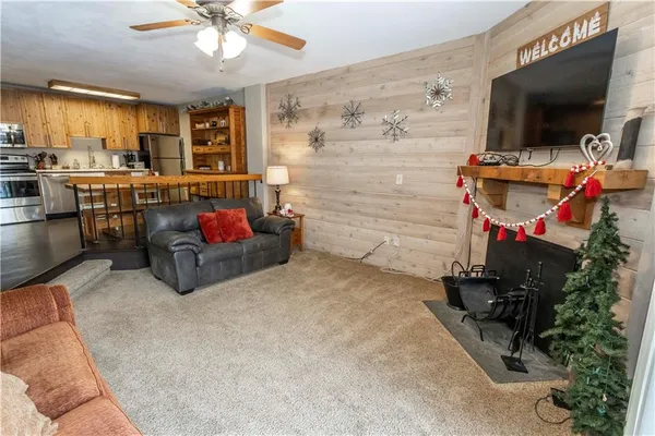 a living room with furniture and flat screen tv