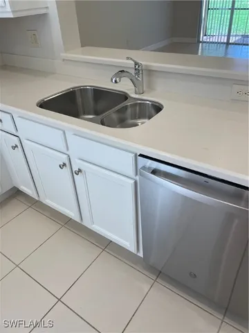 a view white cabinets and a sink