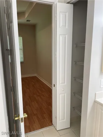 a bathroom with a bathtub sink and mirror