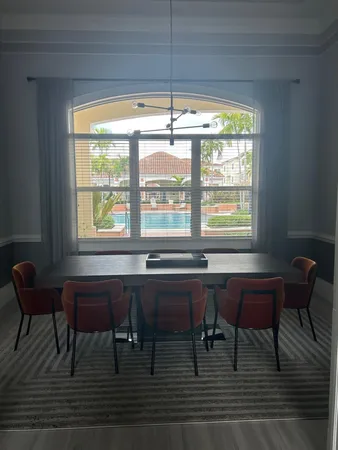 a room with a table and chairs