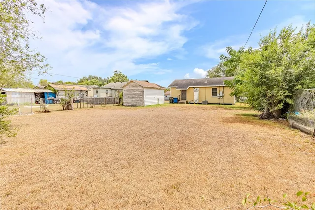 a view of a ocean with buildings in the background