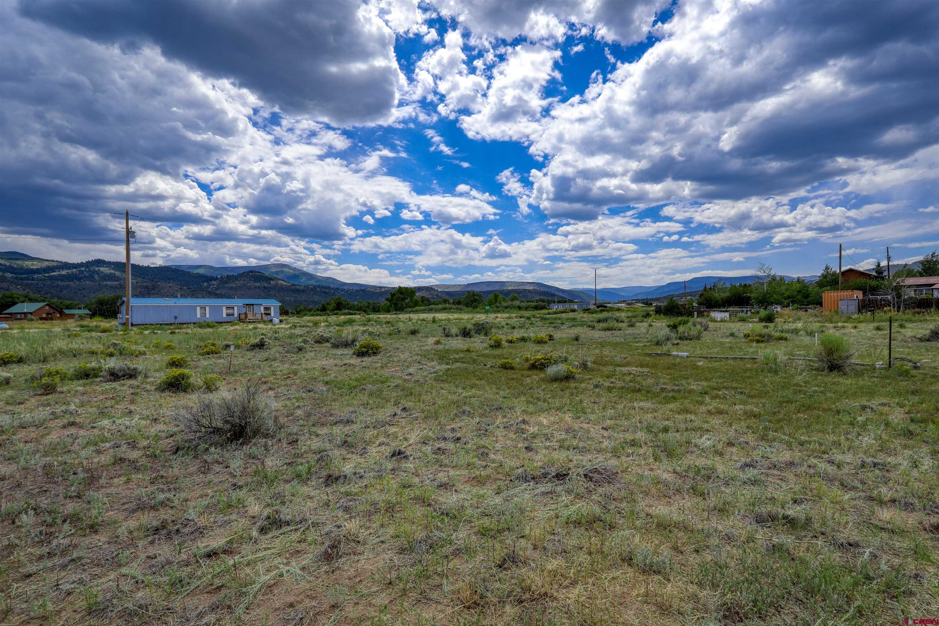 227 Red Feather Road South Fork, CO 81154 - Photo 18 of 32 a view of a garden with an ocean