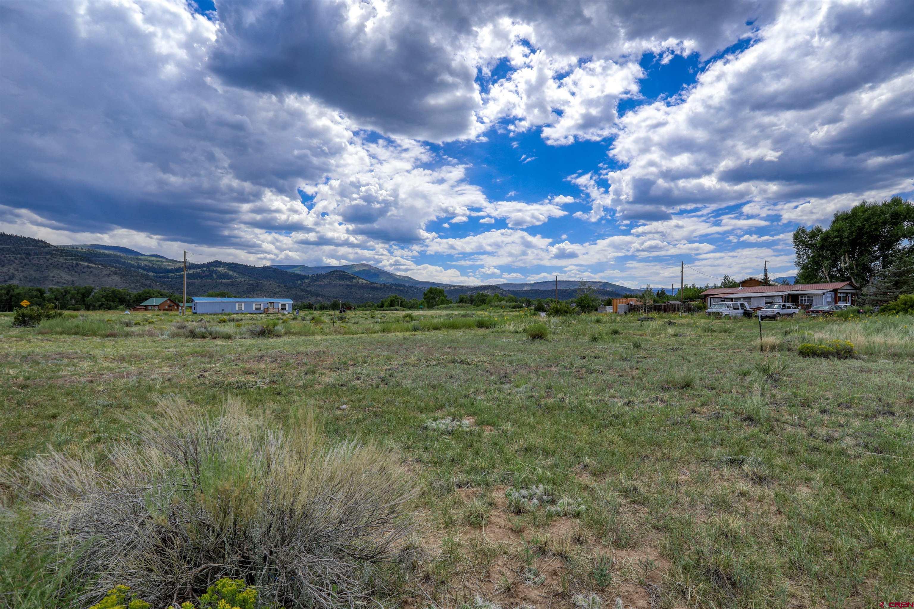 227 Red Feather Road South Fork, CO 81154 - Photo 19 of 32 a view of a houses with a yard
