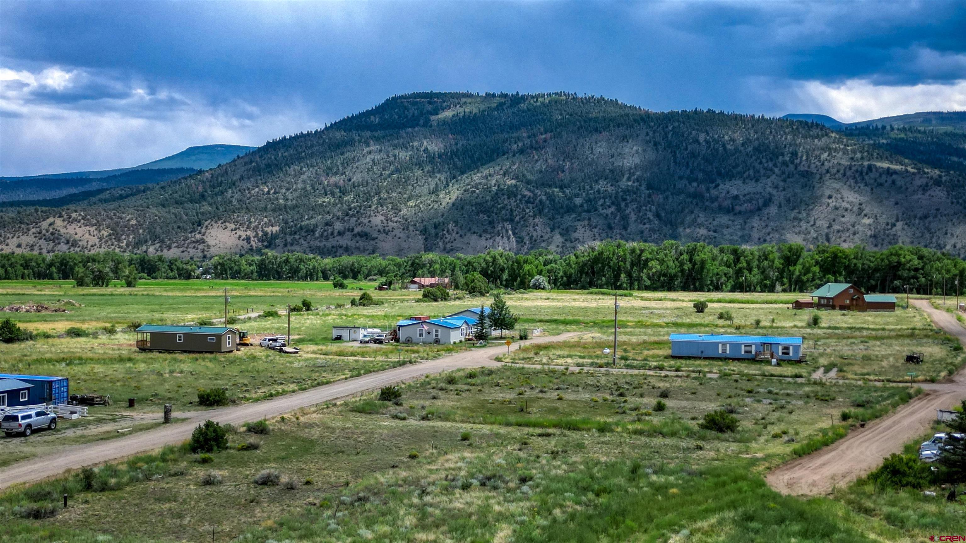 227 Red Feather Road South Fork, CO 81154 - Photo 22 of 32 a view of a golf course with a house