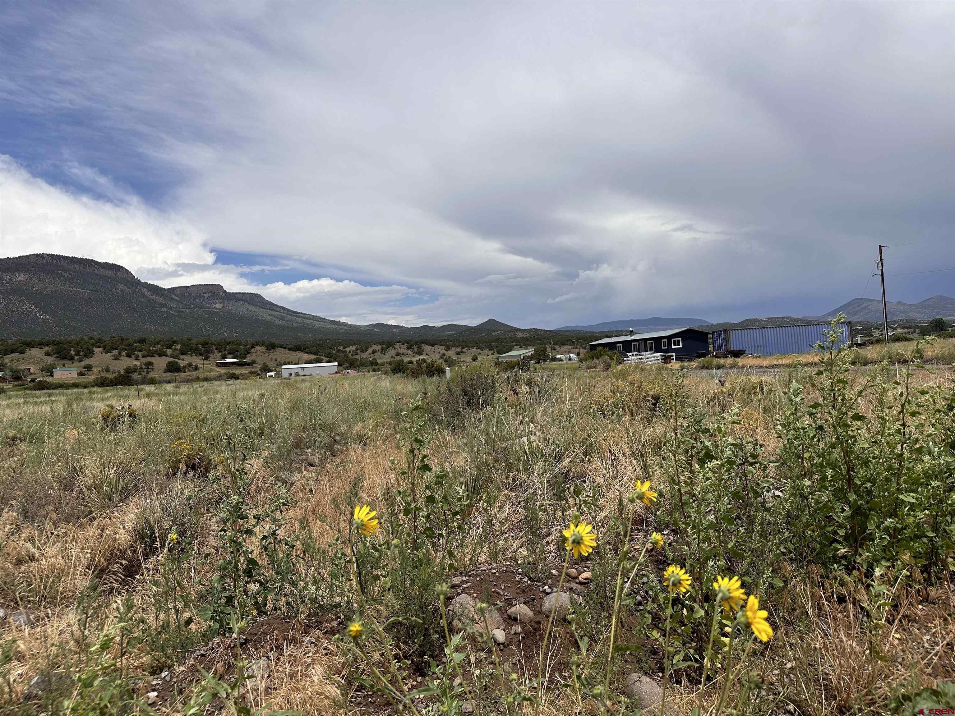 227 Red Feather Road South Fork, CO 81154 - Photo 23 of 32 a view of a lake with a mountain in the background