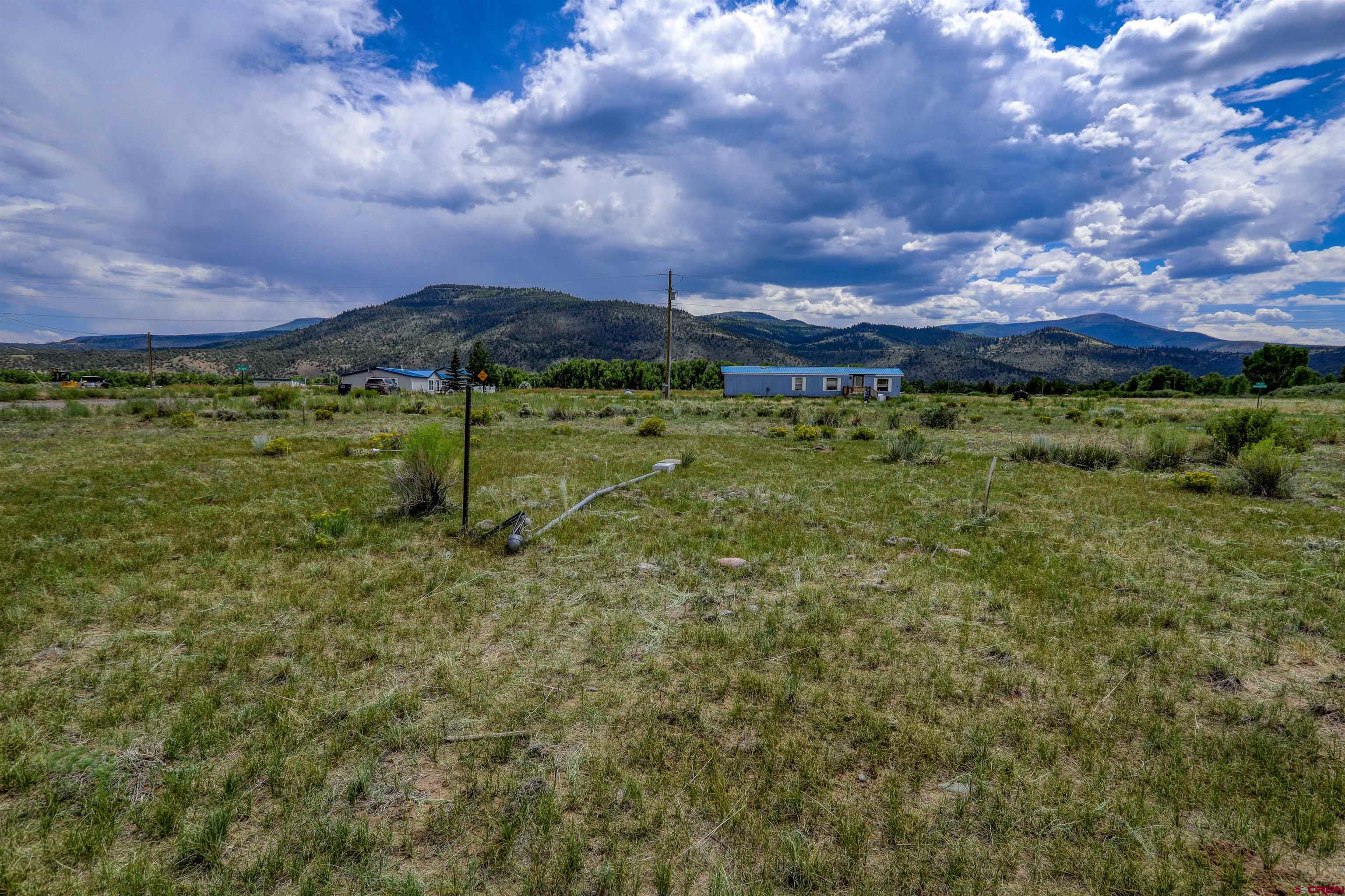 227 Red Feather Road South Fork, CO 81154 - Photo 31 of 32 a view of a town with large trees